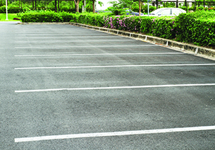 Parking lot showing freshly painted lines for parking spaces